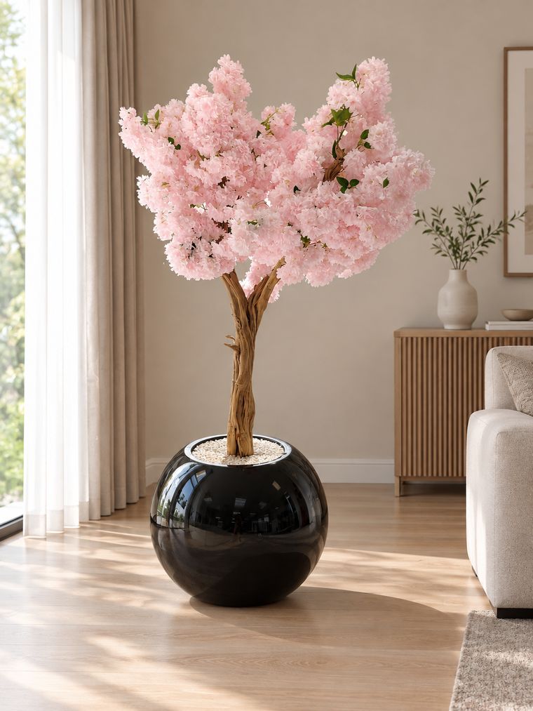 Pink blossom tree in black planter