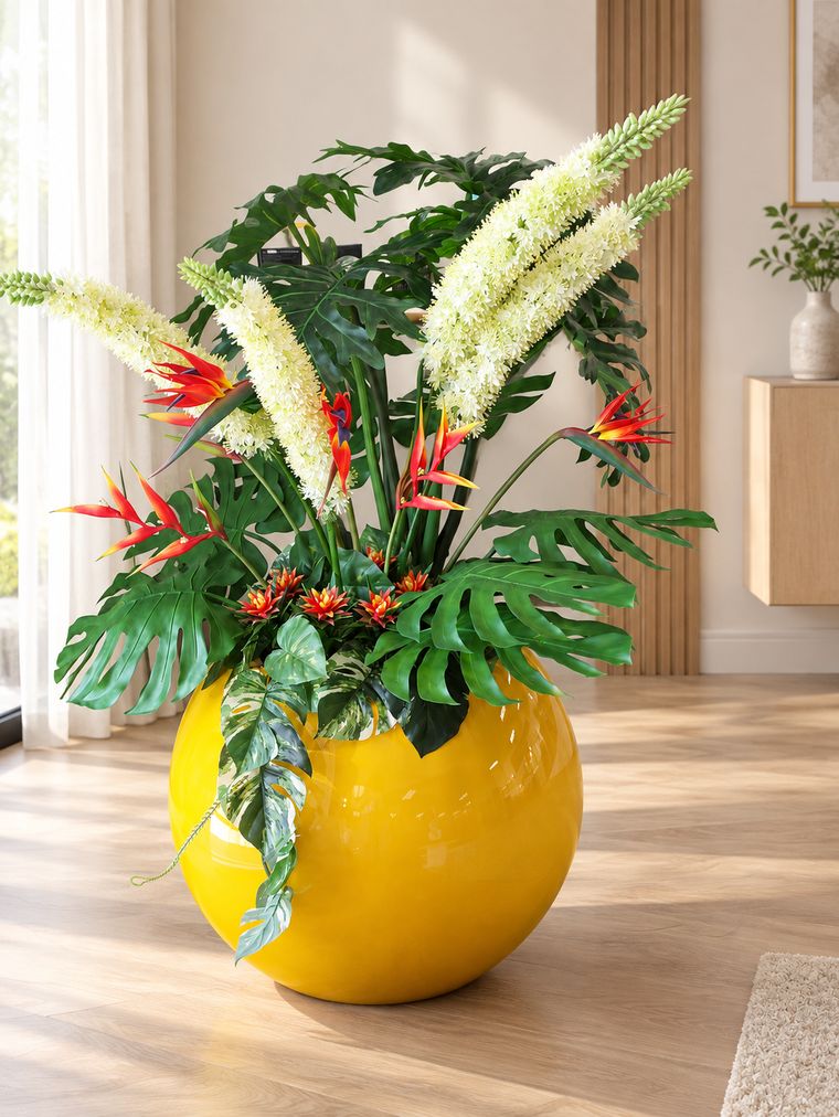 Tropical heliconia arrangement in yellow planter